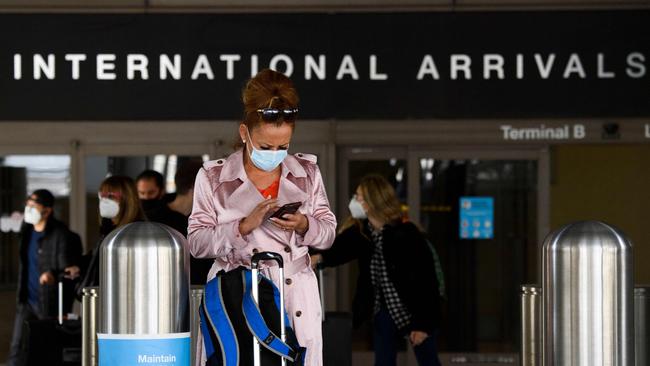 A traveller wears a face mask at Los Angeles International Airport (LAX) amid increased COVID-19 travel restrictions. Picture: AFP