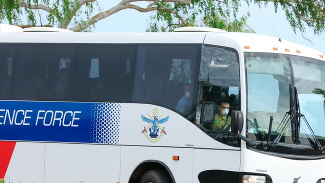 Passengers are taken by bus to quarantine. Picture: Glenn Campbell