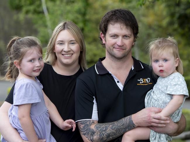 Daniel Goodwin endured a cycle of unending pain caused by a 5.2cm brain tumour. Now the father-of-two must face enduring proton beam therapy in the US because SA doesn't offer the treatment. Daniel at home with daughters Sophie 2, Olivia 4 and wife Danielle. 11th November 2024 Picture: Brett Hartwig