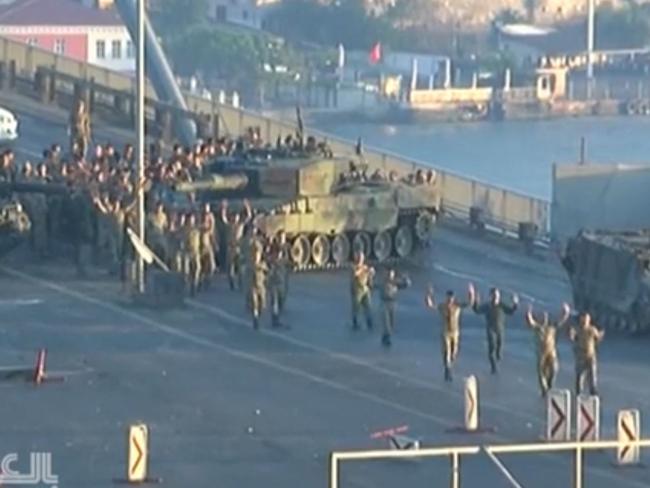 Troops on the Bosporus Bridge appear to surrender in Istanbul. Picture: Twitter.
