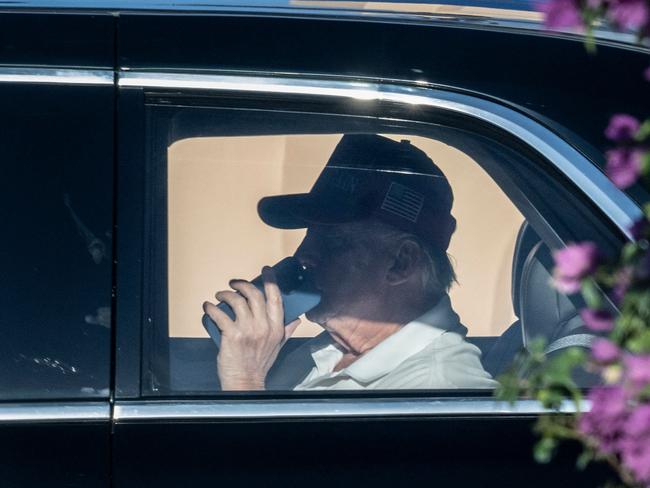 US President Donald Trump leaves the Mar-a-Lago resort in Palm Beach, Florida on his way to play golf with Tiger Woods before heading to the Super Bowl. Picture: AFP