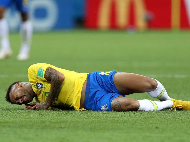 KAZAN, RUSSIA - JULY 06:  Neymar Jr of Brazil goes down injured during the 2018 FIFA World Cup Russia Quarter Final match between Brazil and Belgium at Kazan Arena on July 6, 2018 in Kazan, Russia.  (Photo by Buda Mendes/Getty Images)