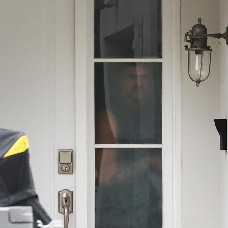 Exclusive: Latrell Mitchell pictured looking outside a window at his house. Picture: Rohan Kelly