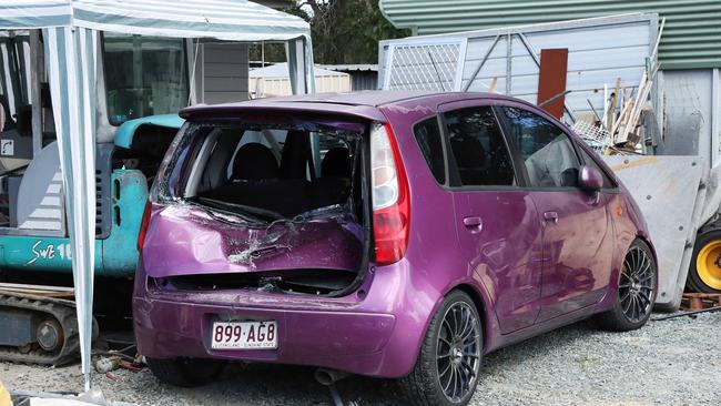 A damaged car at the attempted murder scene where a 27-year-old man allegedly drove over a woman in her back yard at Namatjia Court, Caboolture. Photographer: Liam Kidston.