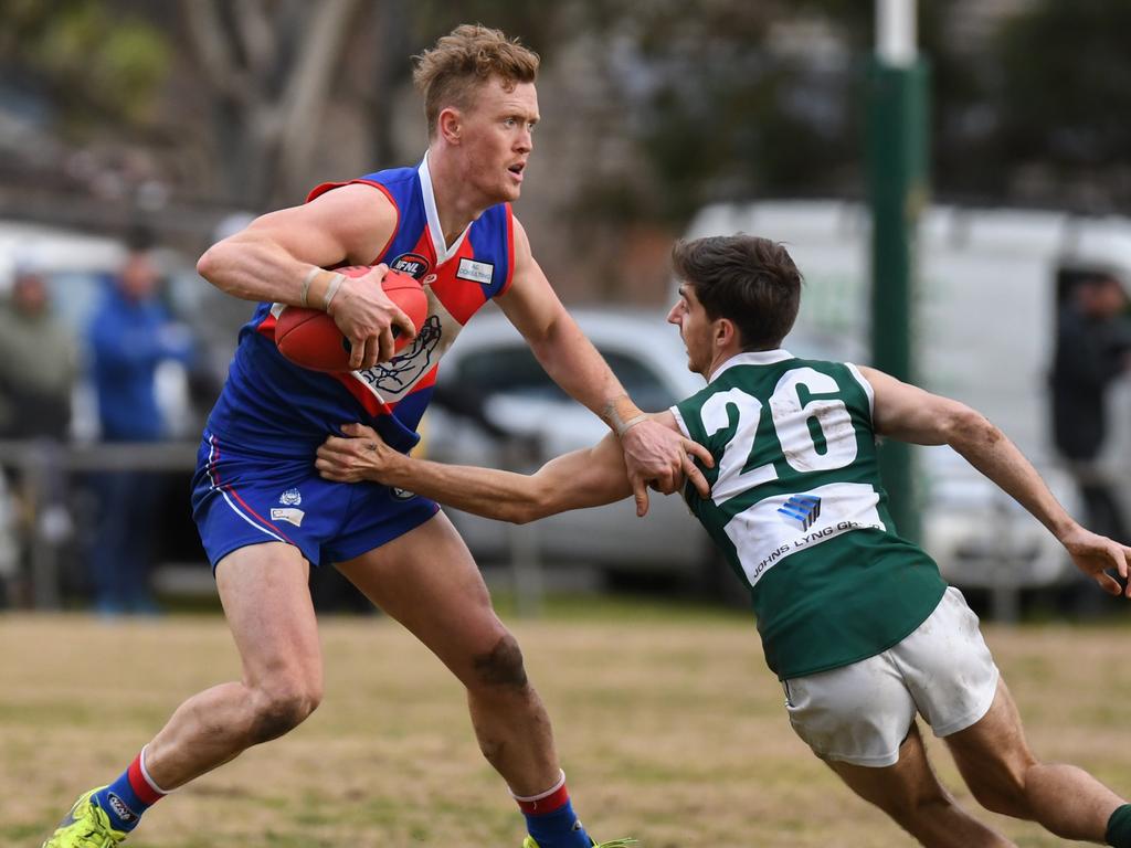 Liam Hunt slips a tackle for North Heidelberg. Picture: Nathan McNeill