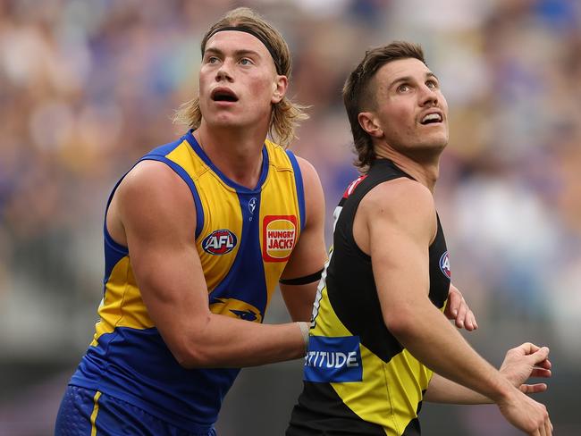 PERTH, AUSTRALIA - APRIL 14: Harley Reid of the Eagles defends Liam Baker of the Tigers during the 2024 AFL Round 05 match between the West Coast Eagles and the Richmond Tigers at Optus Stadium on April 14, 2024 in Perth, Australia. (Photo by Will Russell/AFL Photos via Getty Images)