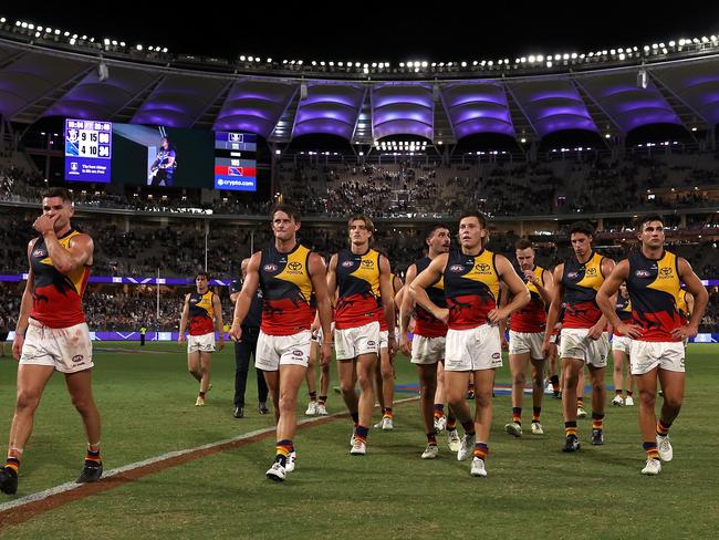 The Crows walk off Optus Stadium after going 0-3. Picture: Paul Kane/Getty Images