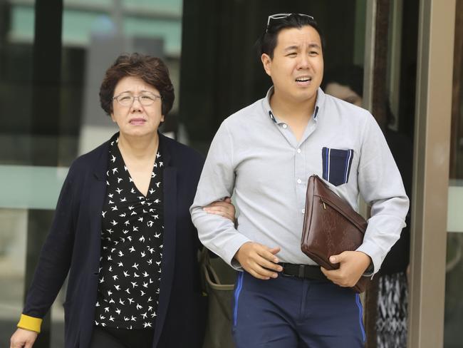 Curtis Cheng's son Alpha Cheng and widow Selina Cheng leave Parramatta District Court today.