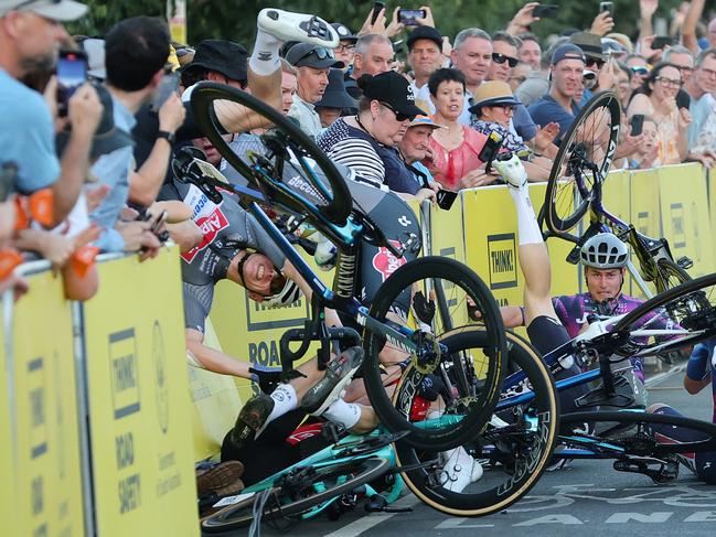 ADELAIDE, AUSTRALIA - JANUARY 18: Crash on last corner with two riders going over the barricade including Tobias BAYER of team DS: Meersman Gianni during day two of the Tour Down Under on January 18, 2025 in Adelaide, Australia. (Photo by Sarah Reed/Getty Images)