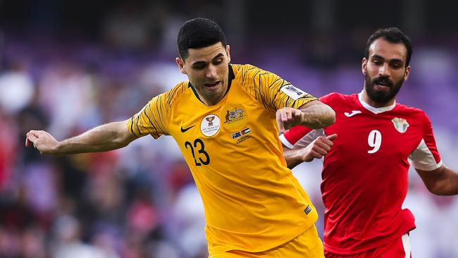 AL AIN, UNITED ARAB EMIRATES - JANUARY 06: Tom Rogic of Australia is challenged by Baha' Faisal of Jordan during the AFC Asian Cup Group B match between Australia and Jordan at Hazza Bin Zayed Stadium on January 06, 2019 in Al Ain, United Arab Emirates. (Photo by Francois Nel/Getty Images)