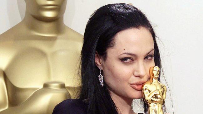 This wasn’t the only smooch Angelina Jolie had that night ...