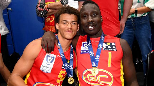 Leonardo Lombard and Mabior Chol of the Suns celebrate following the 2023 VFL premiership. Picture: Morgan Hancock/AFL Photos.