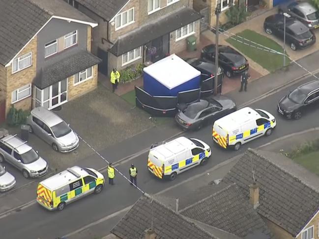 Police at the house where the three women were killed in Bushey. Picture: Sky News