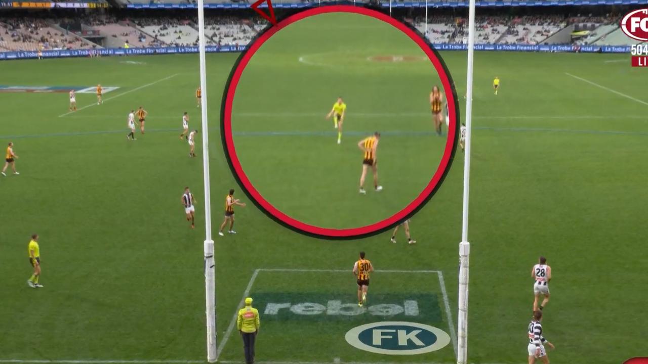 The umpire further away makes the call on Darcy Moore's controversial free kick.