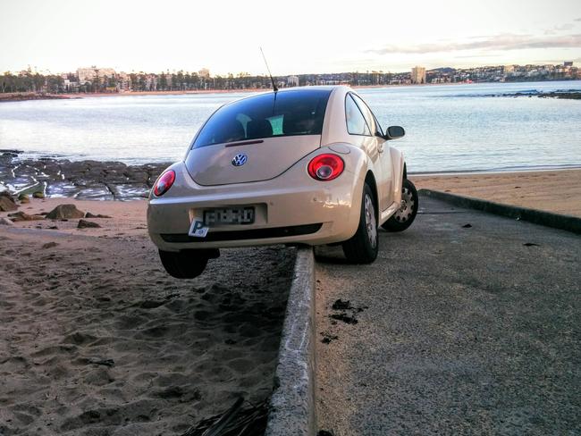 A car ends up off the boat ramp at Shelly Beach. Pic credit: Tim Ettle