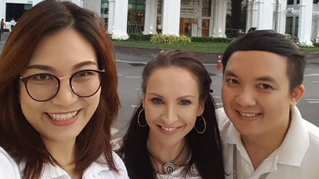 Gold Coast woman Claire Johnson (centre) with friends from the medical industry in Thailand. Photo: Facebook.