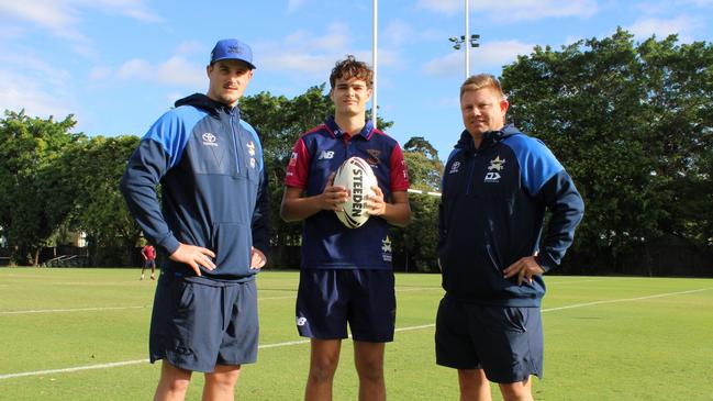 Cowboys Game Development Coach Mitch Dunn (left) and Cowboys Elite Pathway Coach Steve Sheppard (right) stand with St Augustine's College Aaron Payne Cup captain Jack Rix (centre) after announcing the new two year pathway extension between the NQ Cowboys and St Augustine's College. Picture: Jake Garland