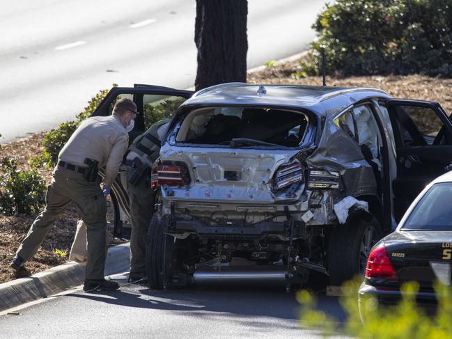 Police inspect the damaged car. Picture: Getty Images/AFP