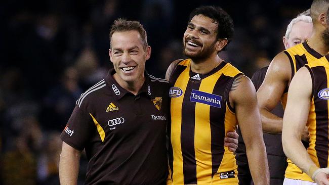 Hawthorn's Cyril Rioli gets a hug from coach Alastair Clarkson in 2016. Picture: Colleen Petch.