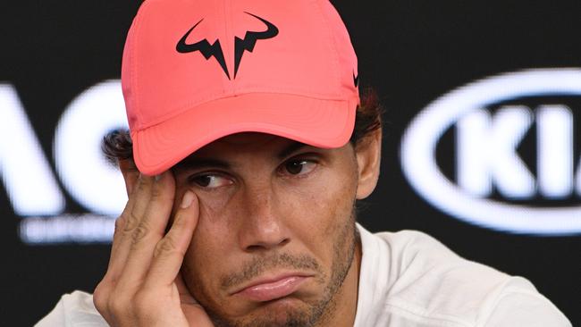 Rafael Nadal attends a press conference after retiring against Croatia's Marin Cilic.