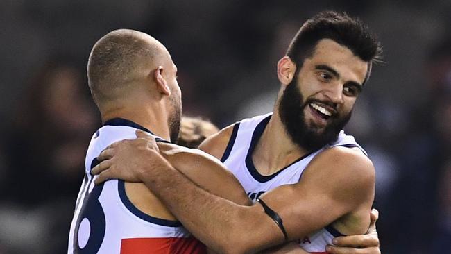 Wayne Milera celebrates one of the Crows many goals with Cam Ellis-Yolmen. Picture: Quinn Rooney/Getty Images