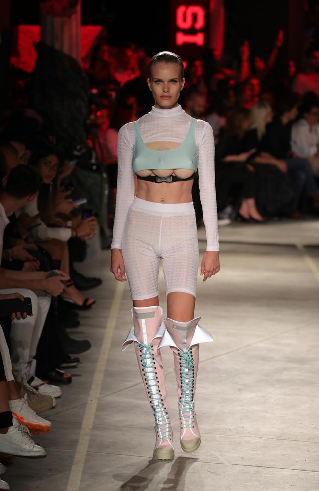 Milan Fashion Week: Models walk runway wearing three-breast bikini