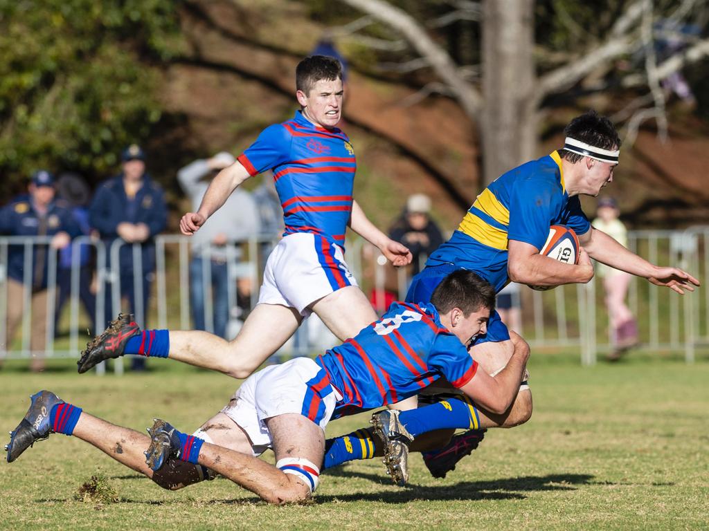 George Griffiths of Grammar is tackled by Rhys Chadburn of Downlands in O'Callaghan Cup on Grammar Downlands Day at Downlands College, Saturday, August 6, 2022. Picture: Kevin Farmer