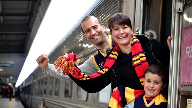 The Overland Train became the “Crowverland” Train when Adelaide Crows fans such as Matt and Jenny Baynes and their son Aiden made the journey from Adelaide to Melbourne for the 2017 AFL Grand Final. Picture: Bianca De Marchi