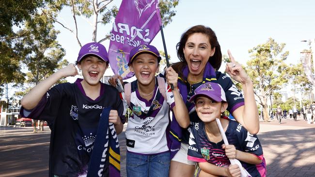 Storm fans Cat Primmer and her daughters from left Taylor, Ella, and Shay at the NRL Grand Final at Accor Stadium. Picture: NewsWire / Jonathan Ng