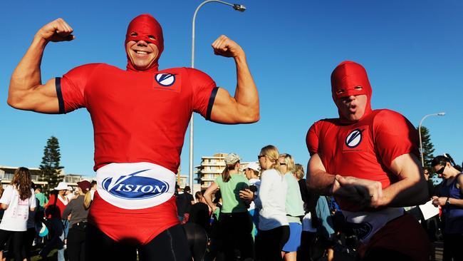 Personal trainers Dan Cook and Mike Wetzlar warm-up at the start of run in 2009. Picture: Braden Fastier