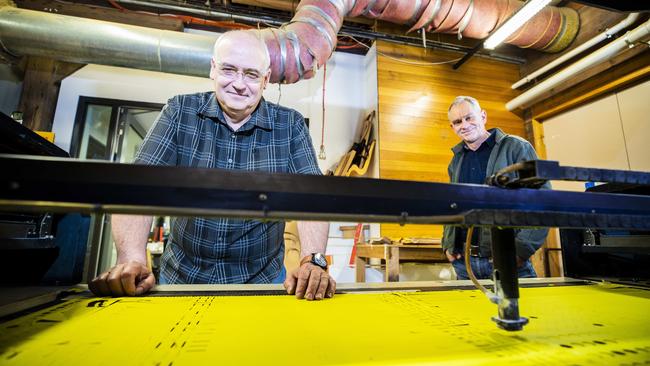 Arts School skills technicians Dr Phill Blacklow and Peter Stannard with the machine used to make the face shields. Picture: RICHARD JUPE