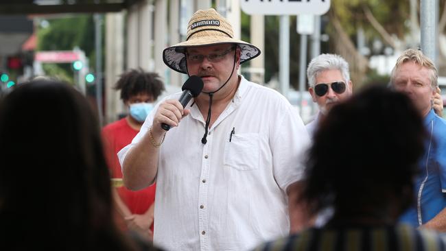 Crime & Justice Action Group spokes person Aaron McLeod speaks at a rally outside Member for Cairns Michael Healy's office on Spence Street. Picture: Brendan Radke