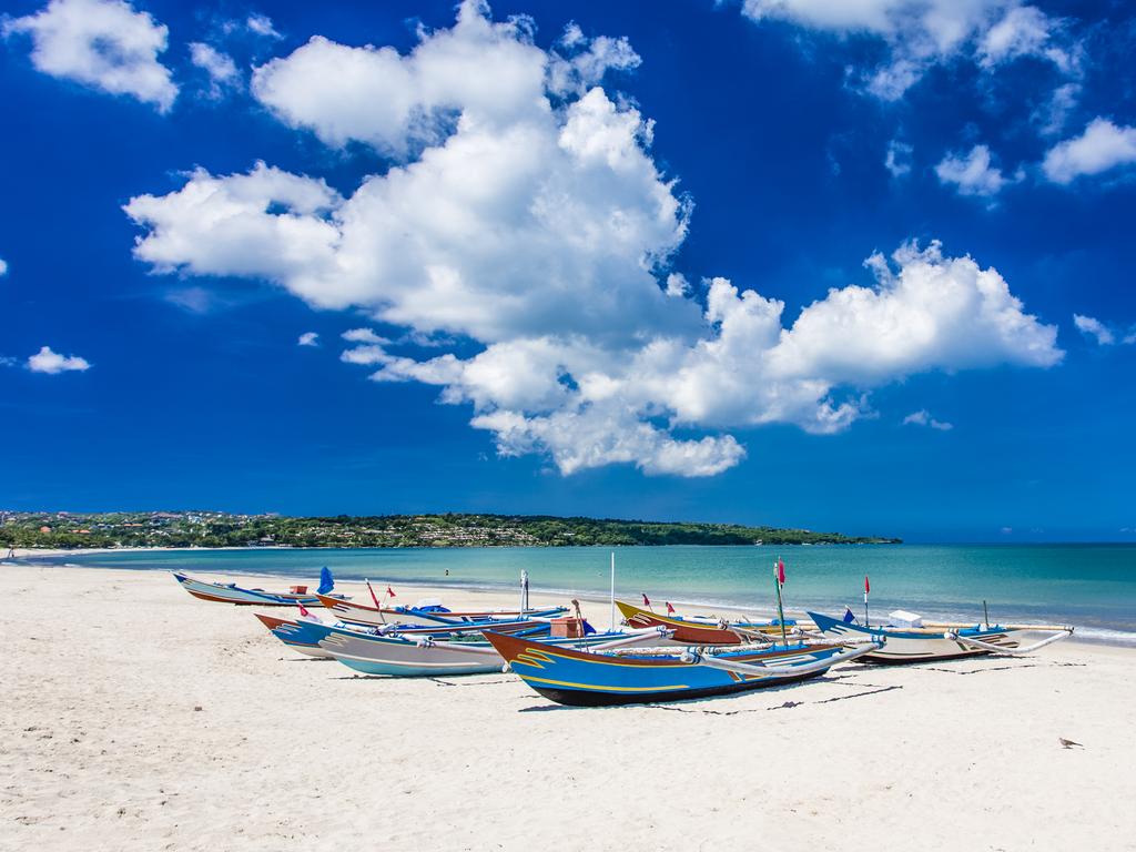 <h2>Hit <strong>Jimbaran Beach</strong></h2><p>One of Bali's most authentic and family-friendly beaches, this calm bay on the island's south is close to the airport and suited to young families. Local kids from the <a href="http://www.bali-indonesia.com/jimbaran/attractions.htm" target="_blank" rel="noopener">nearby village</a> descend here every evening to play soccer and spend time with family, so there's plenty of opportunity for cross-cultural learning. Afterwards, you can dine on freshly cooked seafood while catching the sunset.</p><p class="button-common"><a title="https://klook.prf.hn/click/camref:1011lSLfA/pubref:ESC--evergreen--/destination:https://www.klook.com/en-AU/activity/54278-makan%20malam-seafood-jimbaran-bali/" href="https://klook.prf.hn/click/camref:1011lSLfA/pubref:ESC--evergreen--/destination:https://www.klook.com/en-AU/activity/54278-makan%20malam-seafood-jimbaran-bali/" target="_blank" data-cta="https://klook.prf.hn/click/camref:1011lSLfA/pubref:ESC--evergreen--/destination:https://www.klook.com/en-AU/activity/54278-makan%20malam-seafood-jimbaran-bali/" data-editable="true">Book here</a></p>