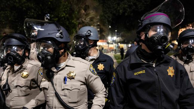 US Police officers stand guard near a pro-Palestinian encampment set up on the campus of the University of California Los Angeles (UCLA) as universities around the US struggle to contain protests on dozens of campuses. Picture: AFP