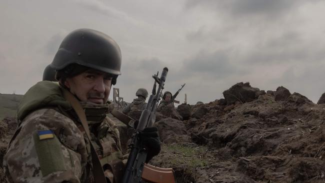 Members of the Ukrainian Military take part in a trench field training exercise in an undisclosed location in the eastern region of Ukraine on March 18. Picture: AFP