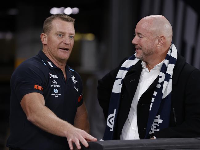 MELBOURNE, AUSTRALIA - APRIL 20:  Michael Voss, Senior Coach of the Blues speaks with President Luke Sayers after the round six AFL match between Carlton Blues and Greater Western Sydney Giants at Marvel Stadium, on April 20, 2024, in Melbourne, Australia. (Photo by Darrian Traynor/Getty Images)