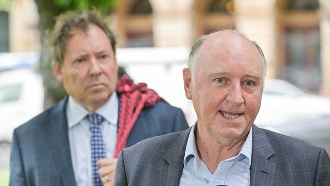 Former Renewal SA boss John Hanlon, right, outside the District Court with his barrister David Edwardson KC after the DPP withdrew all charges against him. Picture: Brenton Edwards