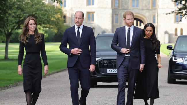 Kate, William, Harry and Meghan arrive to view flowers and tributes to the Queen outside Windsor Castle. Picture: Chris Jackson