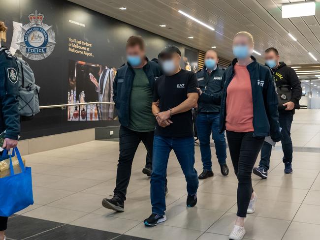 Australian Federal Police escort Chung Chak Lee at Melbourne airport on Saturday June 11. Picture: Supplied.