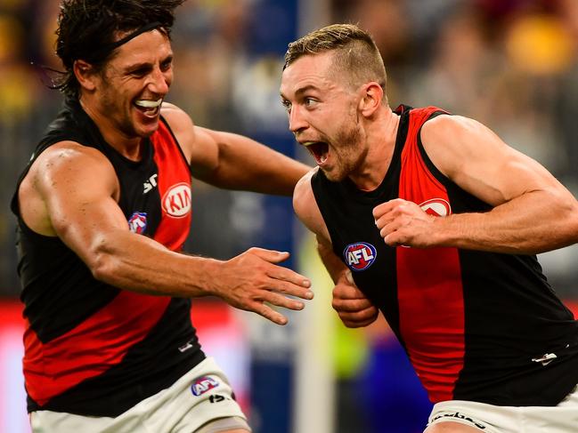 PERTH, AUSTRALIA - JUNE 21: Devon Smith of the Bombers celebrates a goal during the 2018 AFL round 14 match between the West Coast Eagles and the Essendon Bombers at Optus Stadium on June 21, 2018 in Perth, Australia. (Photo by Daniel Carson/AFL Media/Getty Images)