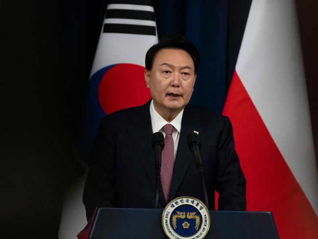 South Korea's President Yoon Suk Yeol speaks with Poland's President Andrzej Duda (not pictured) during a joint press conference at the Presidential Office in Seoul on October 24, 2024. (Photo by JEON HEON-KYUN / POOL / AFP)