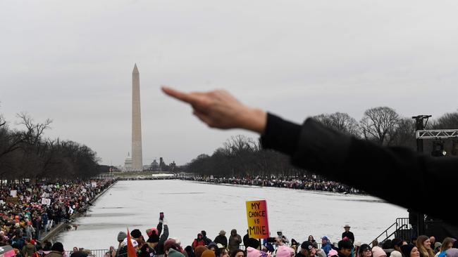 Demonstrators march through downtown Washington, DC, on January 18, ahead of the inauguration. Picture: AFP