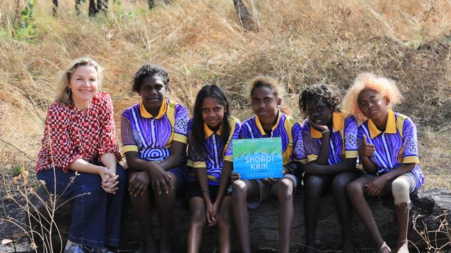 ILF lifetime ambassador and performer Justine Clarke with students from Barunga Remote Community School who wrote the 2024 Busking for Change song, Shordi Krik. Picture: Justine Taylor
