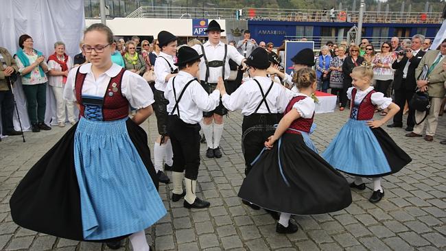 Dancers celebrate the launch of the MS AmaReina, in Vilshofen, Germany.