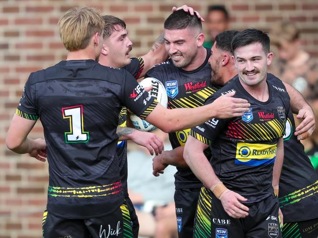 Alex Myles is congratulated after scoring the opening try, Jesse Poulson (No.1) and Isaac Thompson (R). Picture: Adam Wrightson Photography