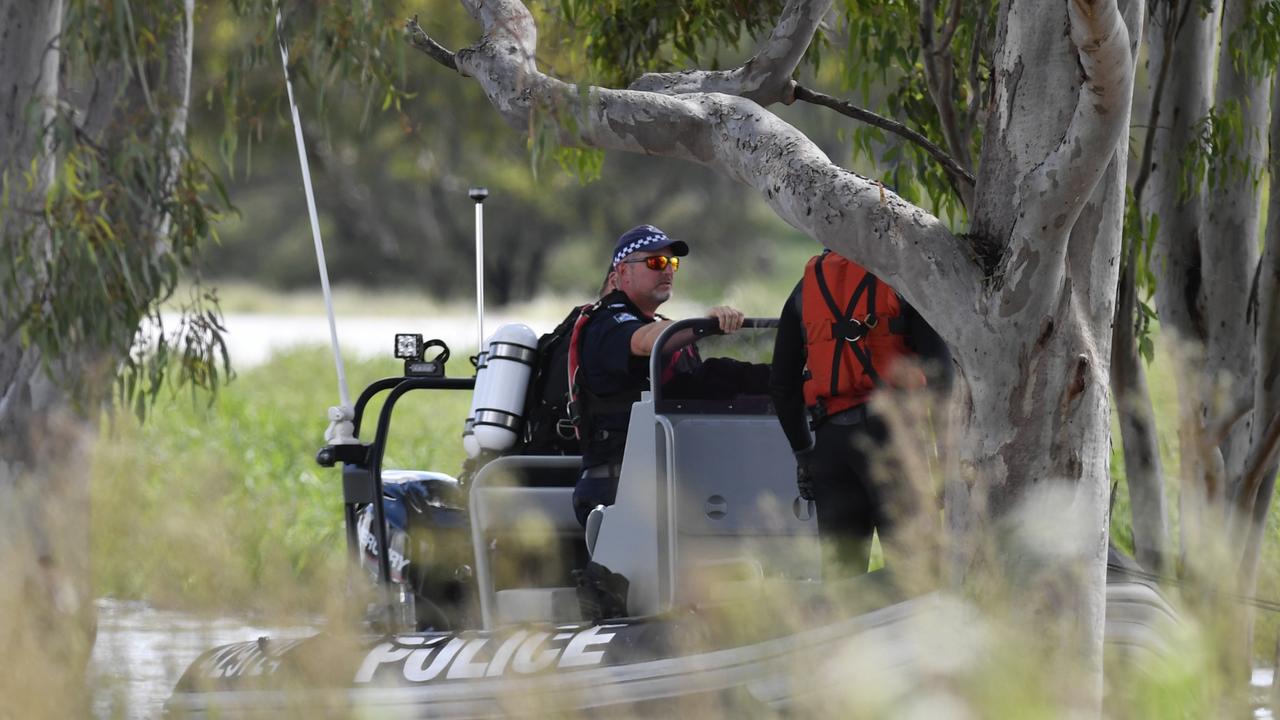 Police during the search for car swept away in floodwaters outside Toowoomba. Picture: Kevin Farmer