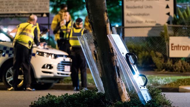 Police riot shields at the scene at the entrance to the Melbourne Youth Justice Centre in Parkville. Picture: Mark Dadswell