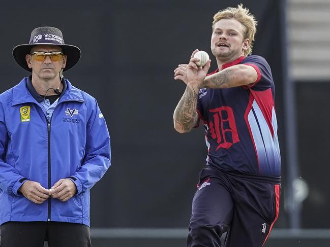 Jack Fowler bowling for Dandenong in a grand final. Picture: Valeriu Campan