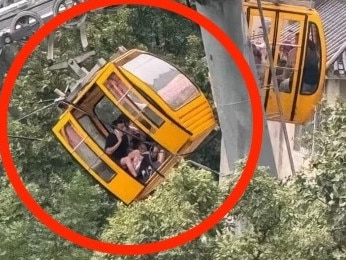 Story from Jam Press (Cable Car Plunges)   Pictured: The tilted cable car after winds caused the doors to spring open.  Tourist plunges 30ft from cable car after door opens in strong winds  A tourist plunged 30ft from a cable car after strong winds caused the doors to spring open.  The 34-year-old woman was taken to hospital with non-life-threatening injuries.  She plummeted from the cable car while it was tilted at a steep angle.  Staff members at the Yandangshan Scenic Area, located south of Shanghai in China, rushed to help the injured woman on the ground.  Meanwhile, officials closed the cable car service and reopened it after carrying out extensive checks.  The yellow cable car had the Chinese text Ã¢â¬ËWelcome to Yandang Mountain CablewayÃ¢â¬â¢ printed on the window.  A man was seen seated next to the open door while apparently making a phone call to report that the woman had fallen out.  Officials said the accident was caused by strong gusts, prompting a technical fault that resulted in the door opening.  They added that it happened just after the gondola left the substation on Tuesday (1 Oct).  The victim was hospitalised with non-life-threatening injuries, as reported by NeedToKnow.  An investigation into the accident is ongoing.  ENDS