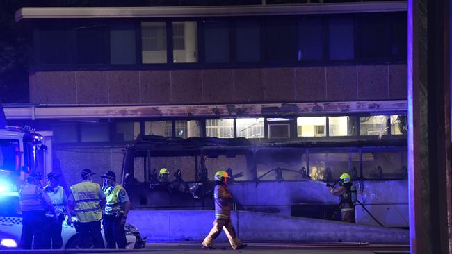 Chaos … Police and fire brigades officers at the scene last night. Picture: Gordon McComiskie